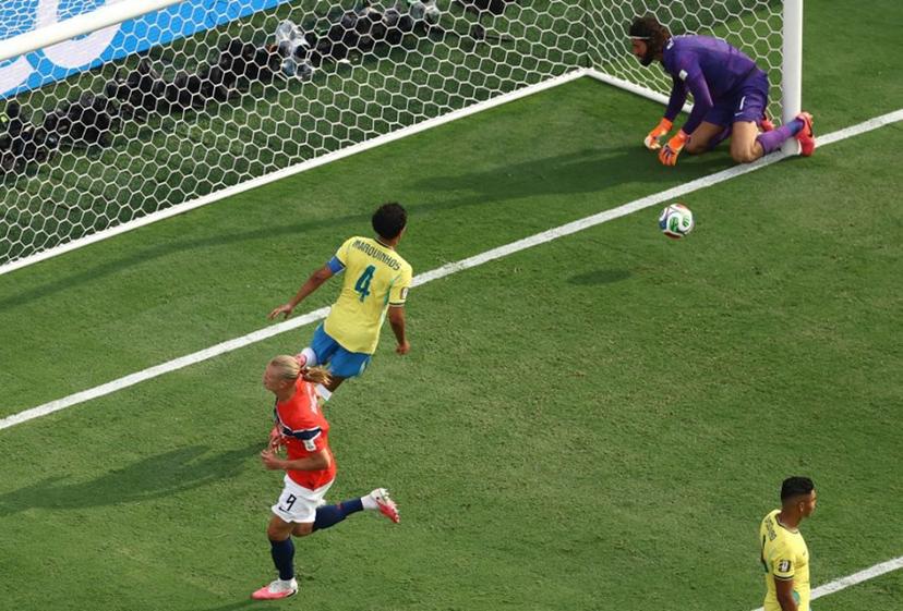 Norway's forward #09 Erling Braut Haaland (L) reacts after scoring his team's first goal during the 2026 World Cup round of 16 football match between Brazil and Norway at the New York/New Jersey Stadium in East Rutherford on July 5, 2026. CHARLY TRIBALLEAU / AFP