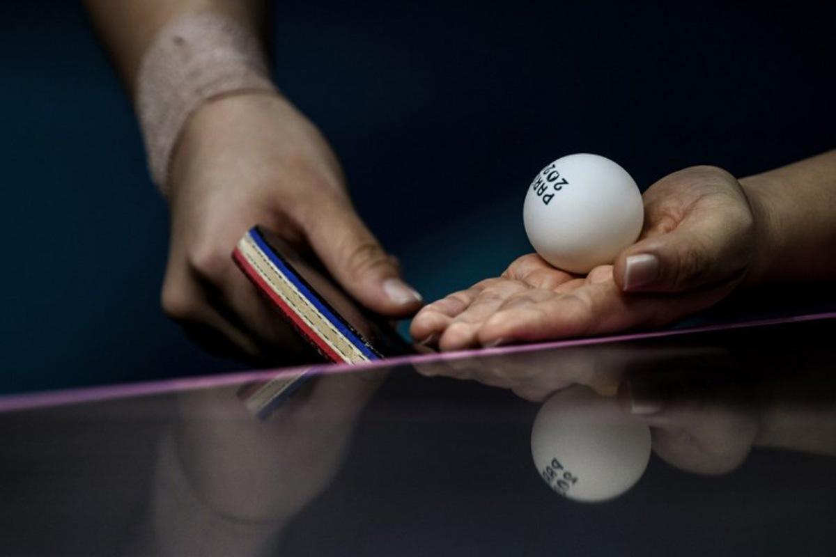 South Korea's Shin Yubin prepares to serve to Japan's Miu Hirano during their women's table tennis singles quarter-finals at the Paris 2024 Olympic Games at the South Paris Arena in Paris on August 1, 2024. JEFF PACHOUD / AFP