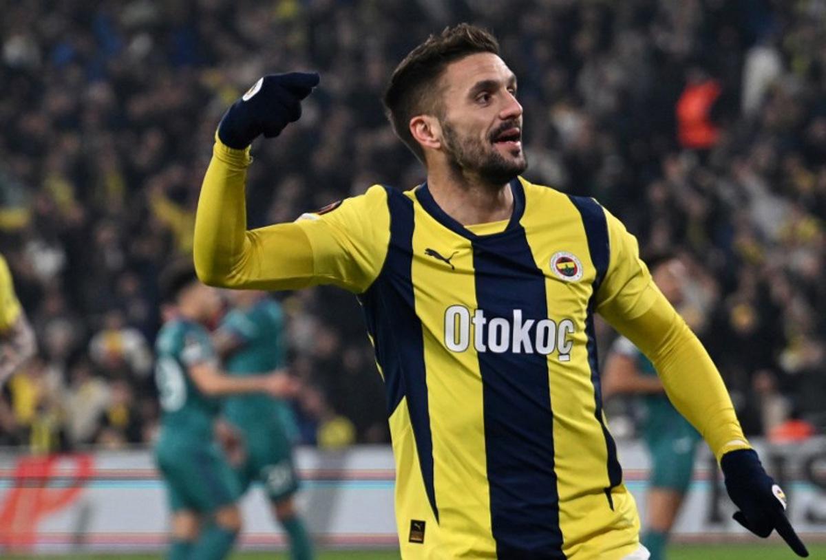 Fenerbahce's Serbian midfielder #10 Dusan Tadic celebrates after scoring his team's first goal during the UEFA Europa League, knockout play off first leg football match between Fenerbahce SK and Anderlecht at Fenerbahce Sukru Saracoglu Stadium in Istanbul, on February 13, 2025. Ozan KOSE / AFP