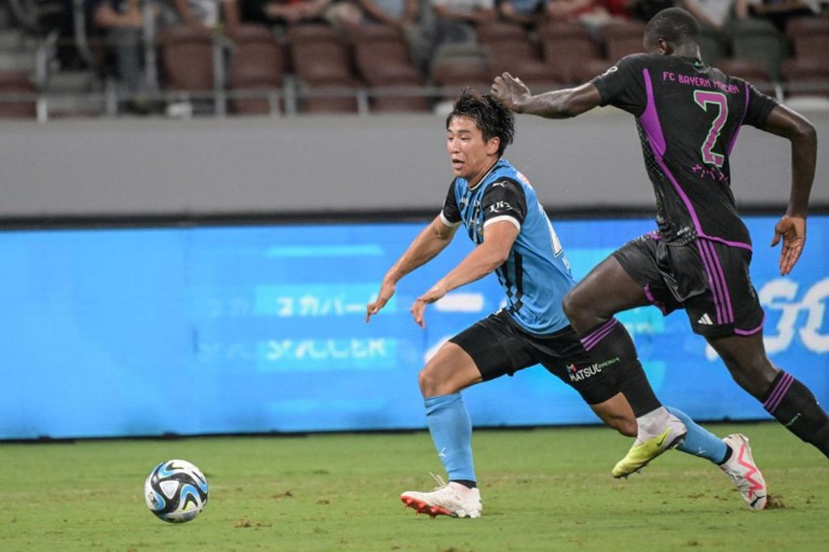 Kawasaki Frontale's Shin Yamada (L) fights for the ball with Bayern Munich's Dayot Upamecano during the football friendly match between Japan's Kawasaki Frontale and Germany's Bayern Munich at the National Stadium in Tokyo on July 29, 2023. Richard A. Brooks / AFP