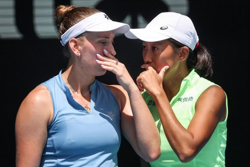 Belgium's Elise Mertens (L) talks to partner China's Zhang Shuai during their women's doubles final match against Kazakhstan's Anna Danilina and Serbia's Aleksandra Krunic on day fourteen of the Australian Open tennis tournament in Melbourne on January 31, 2026. DAVID GRAY / AFP
