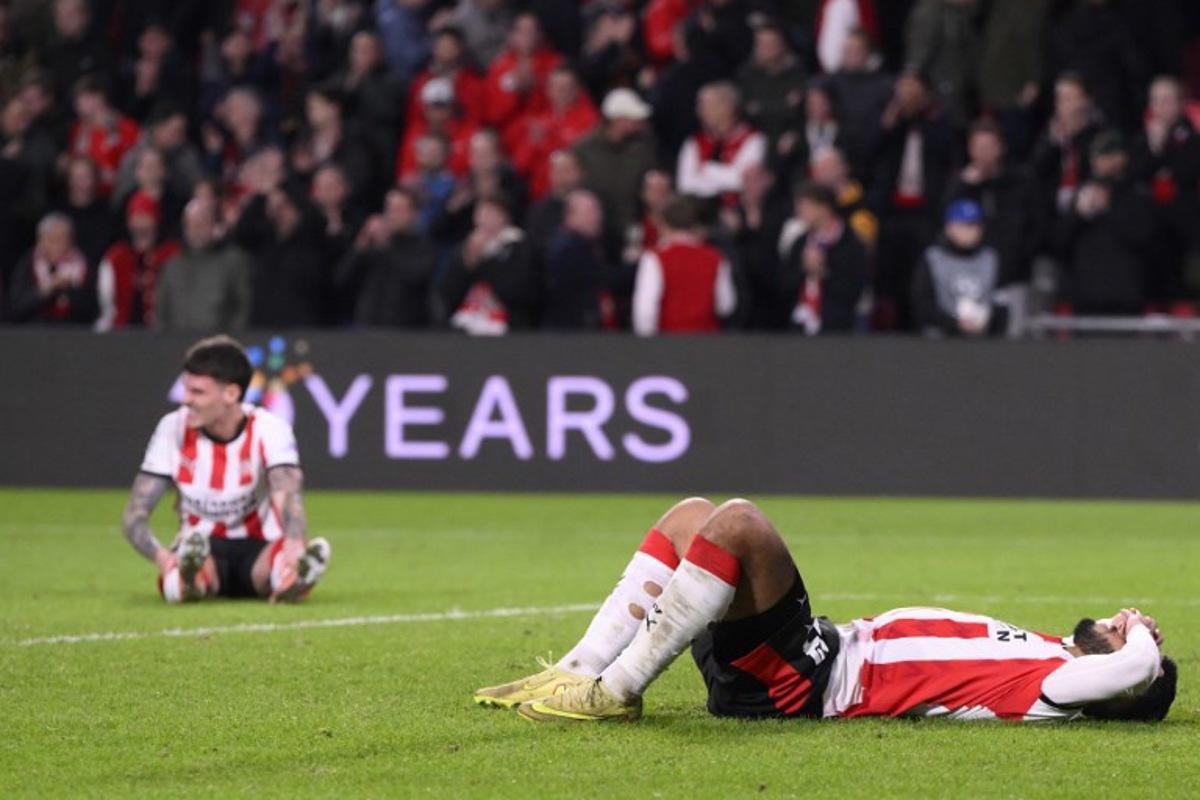 PSV players react at the end of the UEFA Champions League, league phase day 6, football match between PSV Eindhoven (NED) and Atletico Madrid (ESP), at the Philips Stadion, in Eindhoven, south of The Netherlands, on December 9, 2025. JOHN THYS / AFP