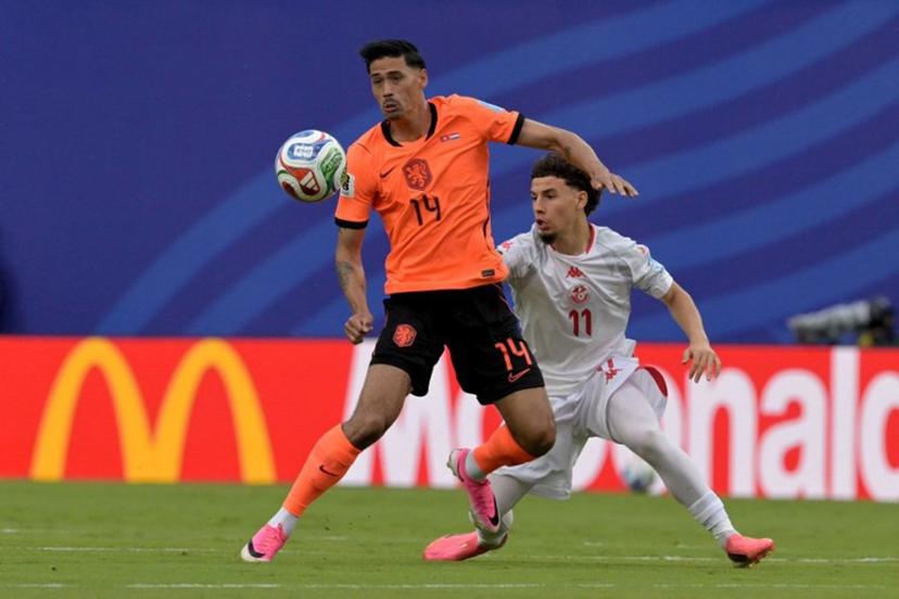 Netherlands' midfielder #14 Tijjani Reijnders and Tunisia's midfielder #11 Ismael Gharbi fight for the ball during the 2026 World Cup Group F football match between Tunisia and the Netherlands at the Kansas City Stadium in Kansas City on June 25, 2026. Juan MABROMATA / AFP