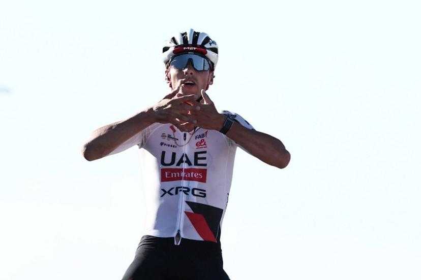 UAE Team Emirates XRG Switzerland's Jan Christen celebrates his victory as he crosses the finish line of the fifth and last stage of the AlUla Tour cycling race, 163.9km from Alula Old Town to Skyviews of Harrat Uwayrid on January 31, 2026. Anne-Christine POUJOULAT / AFP