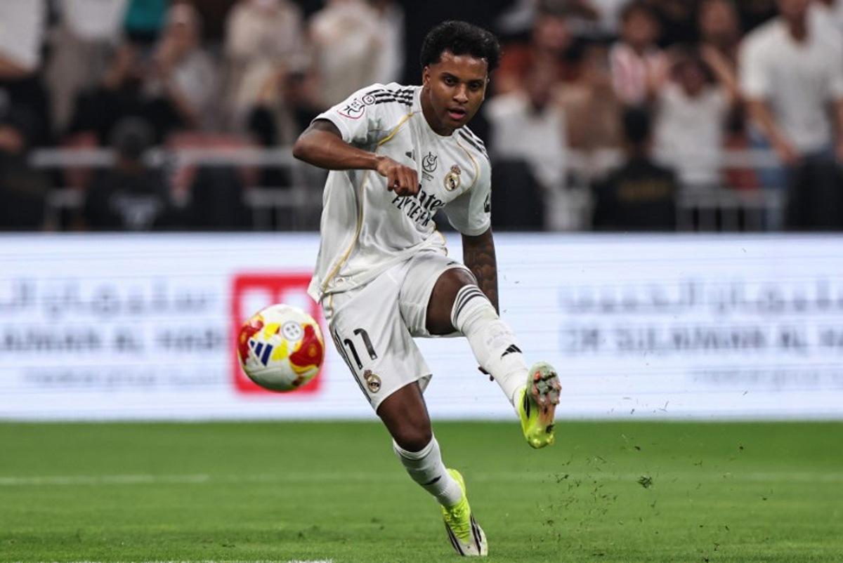 Real Madrid's Brazilian forward #11 Rodrygo kicks the ball during the Spanish Supercup semi-final football match between Atletico Madrid and Real Madrid at King Abdullah Sports City in Jeddah on January 8, 2026. Fadel SENNA / AFP