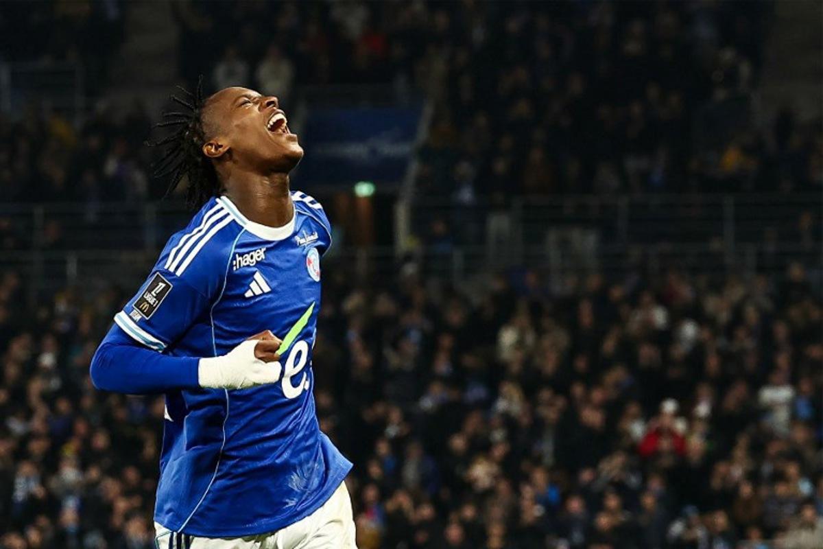 Strasbourg's Dutch forward #10 Emanuel Emegha celebrates after scoring his team's second goal during the French L1 football match between RC Strasbourg Alsace and Lille LOSC at the Stade de la Meinau in Strasbourg, eastern France, on November 9, 2025. Frederick FLORIN / AFP