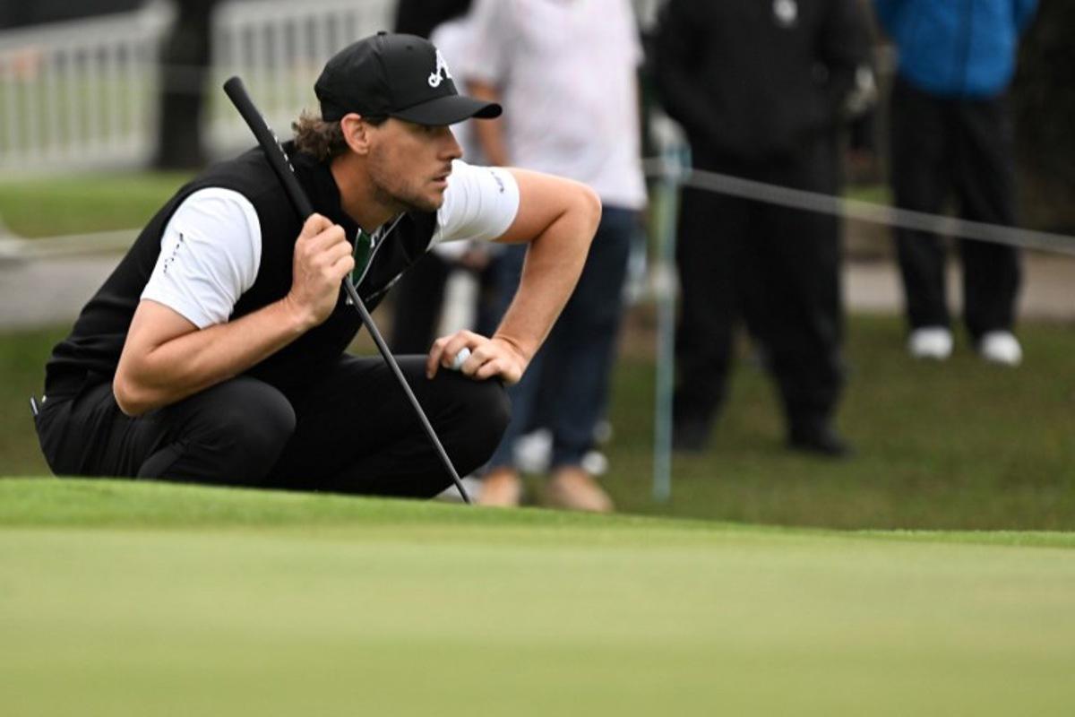 LIV team 4ACES GC player Thomas Pieters of Belgium lines up a putt on day one of the LIV Golf tournament at Fanling golf club in Hong Kong on March 7, 2025. Peter PARKS / AFP