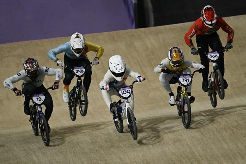 (From L) US' #12 Cameron Wood, Belgium's #248 Ruben Gommers, France's #100 Romain Mahieu, Colombia's #741 Diego Alejandro Arboleda Ospina and Morocco's #266 Dean Reeves compete in first heat of the third run of the Men's Cycling BMX Racing quarterfinals during the Paris 2024 Olympic Games in Saint-Quentin-en-Yvelines, on August 1, 2024. Mauro PIMENTEL / AFP