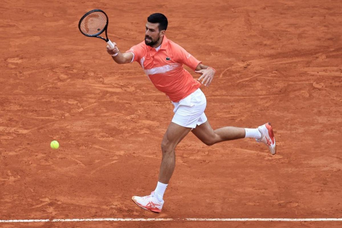 Serbia's Novak Djokovic plays a forehand return to Chile's Alejandro Tabilo during the Monte Carlo ATP Masters Series Tournament round of 32 tennis match on the Ranier III court at the Monte Carlo Country Club in Roquebrune-Cap-Martin on April 9, 2025. Valery HACHE / AFP