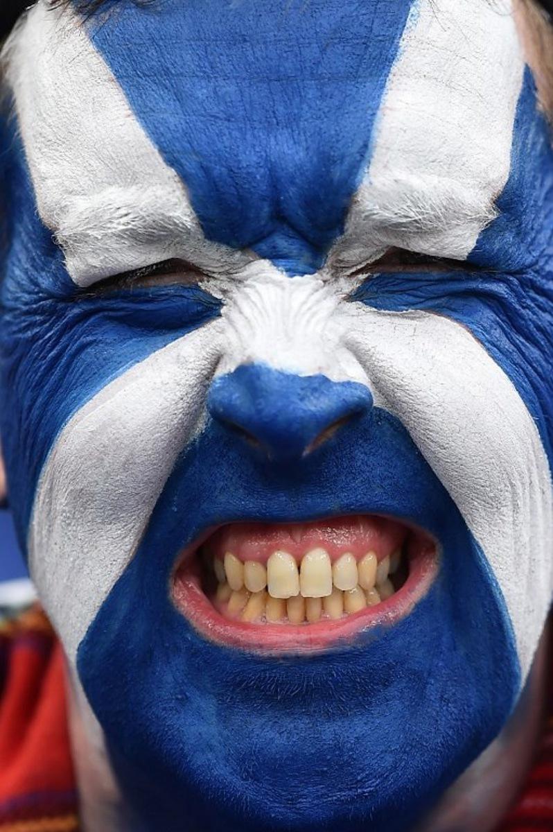 A member of the Tartan Army poses for a picture ahead of the friendly international football match between Scotland and Ivory Coast at the Hill Dickinson Stadium in Liverpool, north west England on March 31, 2026. PETER POWELL / AFP