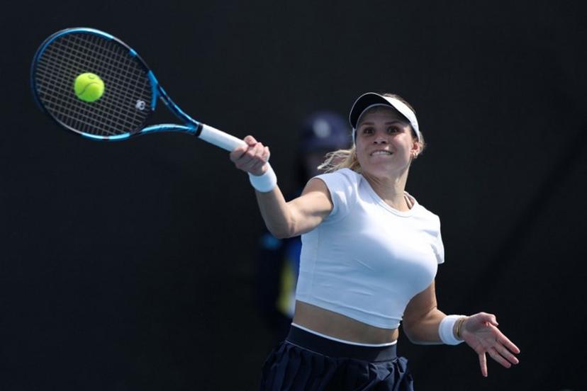 Croatia's Jana Fett hits a return against Britain's Harriet Dart during their women's singles match on day two of the Australian Open tennis tournament in Melbourne on January 13, 2025. Adrian Dennis / AFP