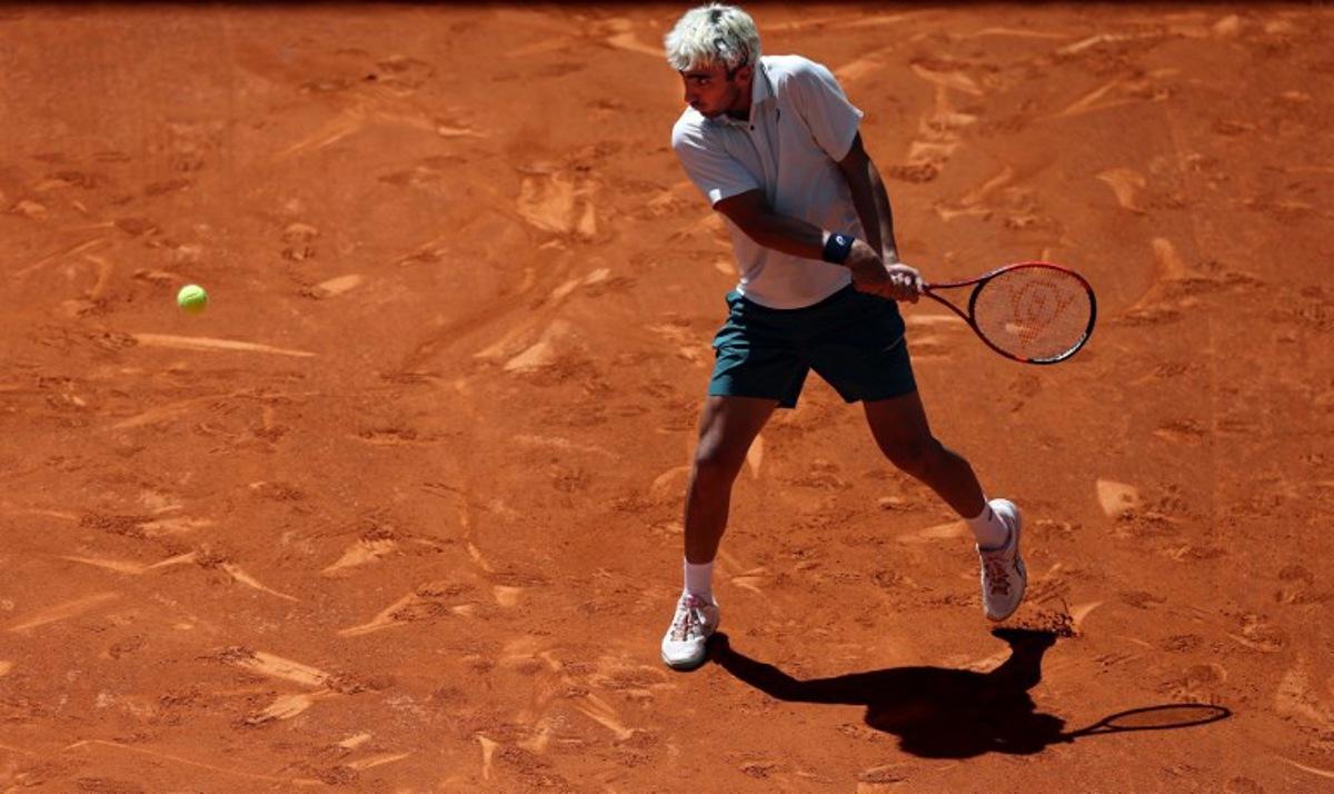 Spain's Daniel Merida returns the ball to Greece's Stefanos Tsitsipas during their 2026 ATP Tour Madrid Open tennis tournament third round singles match at the Caja Magica in Madrid, on April 27, 2026. Thomas COEX / AFP