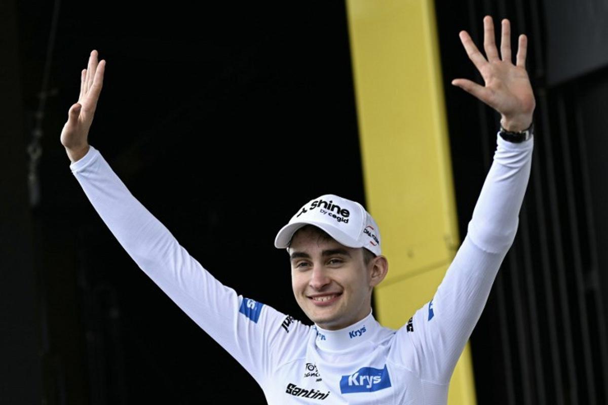 Decathlon CMA CGM Team's French rider Paul Seixas celebrates on the podium with the best young rider's white jersey after the 14th stage of the 113th edition of the Tour de France cycling race, 155,3 km between Mulhouse and Le Markstein in the Vosges mountains, on July 18, 2026. Loic VENANCE / AFP
