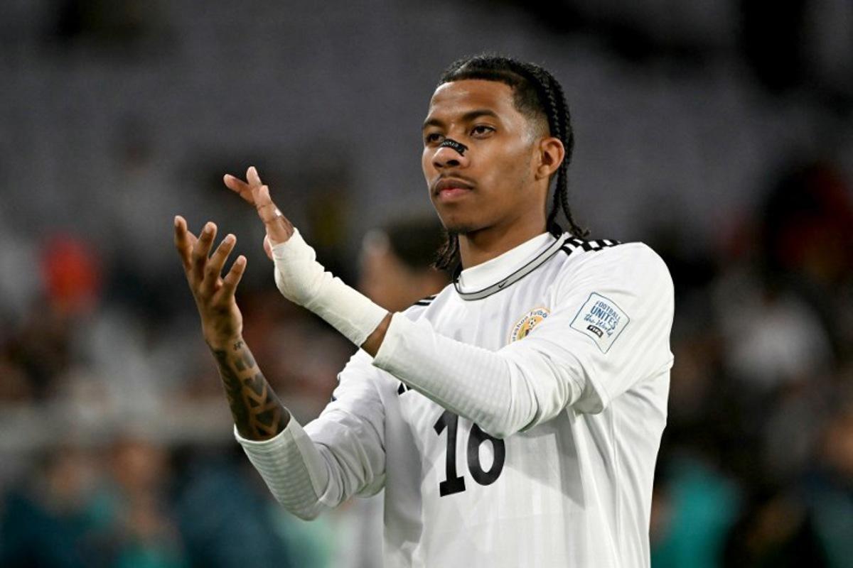 Curacao's Jearl Margaritha reacts to supporters after the international friendly football match between Curacao and China at Stadium Australia in Sydney on March 27, 2026. SAEED KHAN / AFP