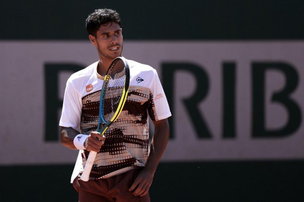 Paraguay's Adolfo Daniel Vallejo reacts after a point as he plays against Great Britain's Cameron Norrie during their men's singles match on day 3 of the French Open tennis tournament at the Roland-Garros Complex in Paris on May 26, 2026. Alain JOCARD / AFP