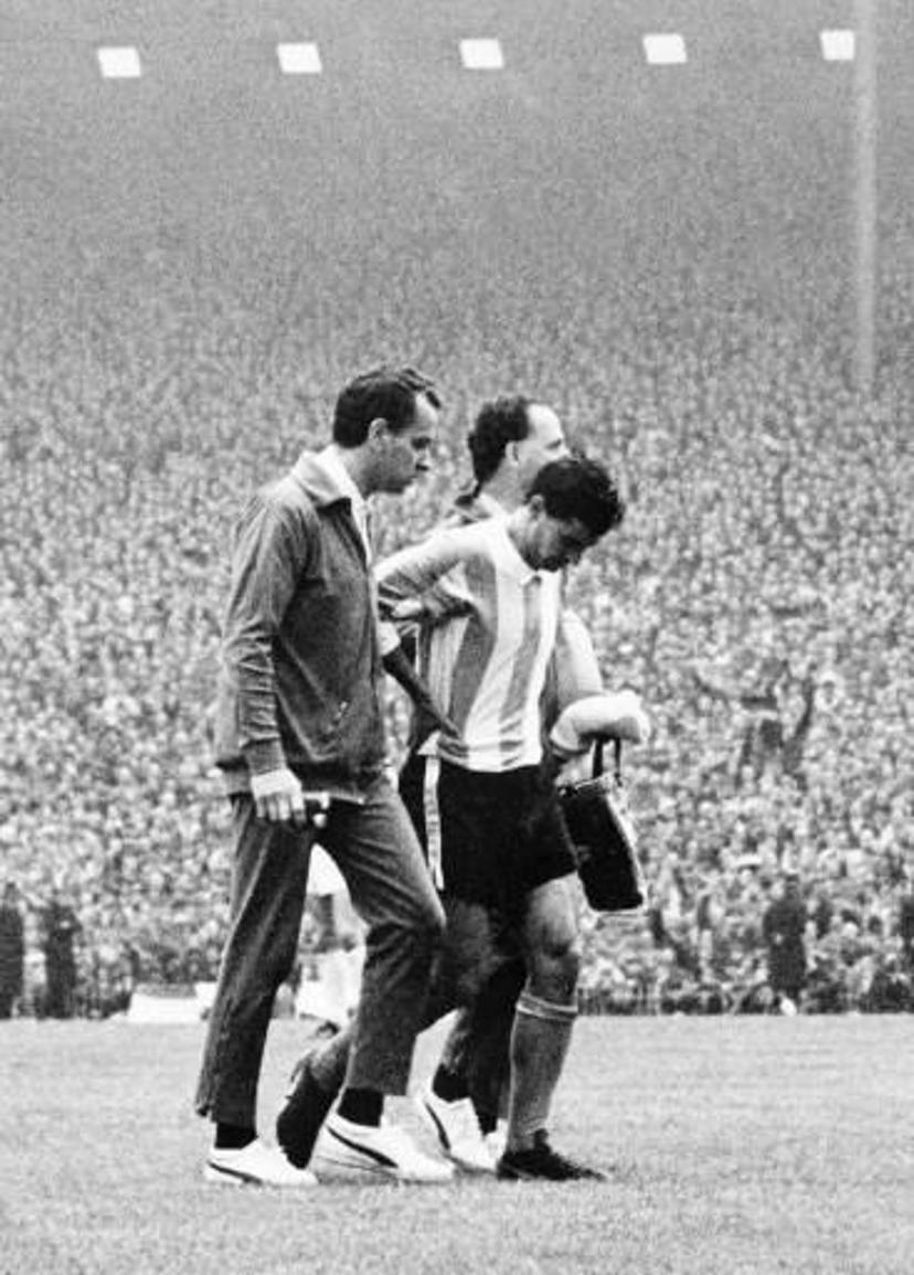 Argentinian national soccer team captain and midfielder Antonio Rattin bows his head as he walked off the field after being sent off by German referee Rudolf Kreitlein 23 July 1966 at Wembley stadium in London during the World Cup quarterfinal match between England and Argentina. English forward Geoff Hurst scored the winning goal in the second half as England beat Argentina 1-0. AFP PHOTO