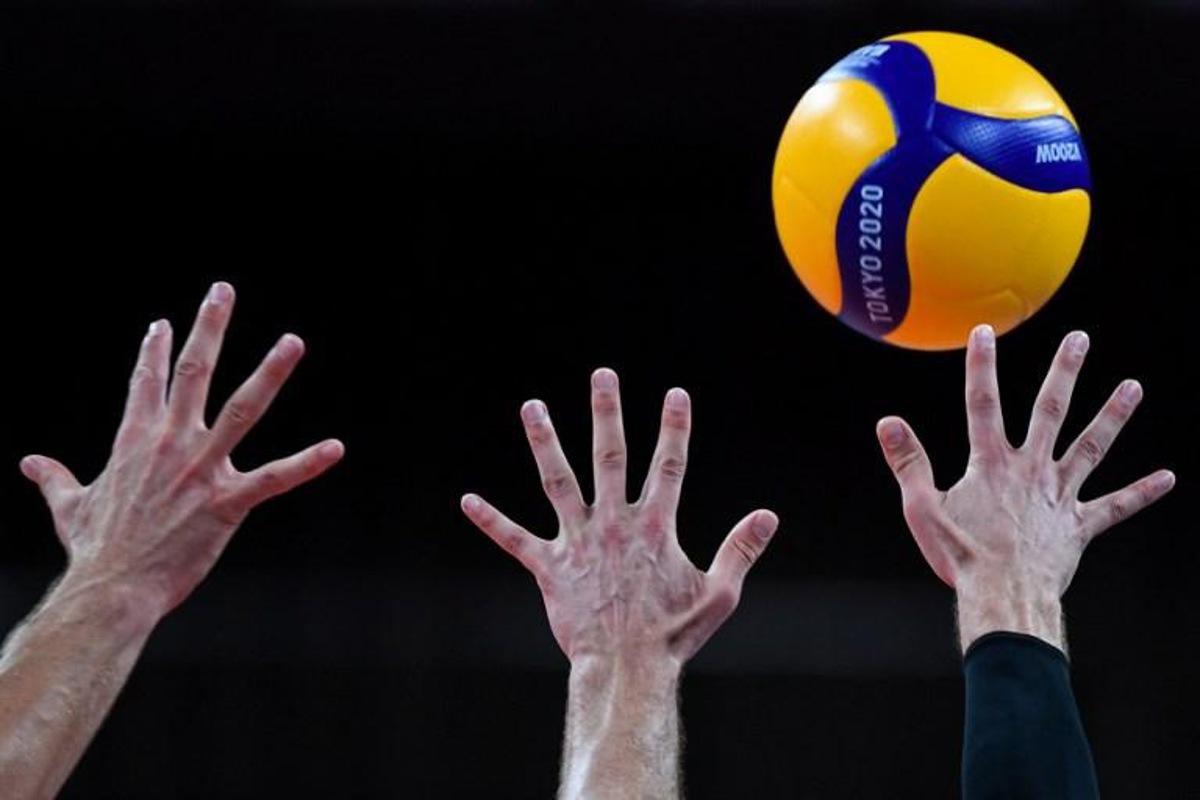Canada's players attempt to block a shot in the men's preliminary round pool A volleyball match between Japan and Canada during the Tokyo 2020 Olympic Games at Ariake Arena in Tokyo on July 26, 2021. Yuri Cortez / AFP