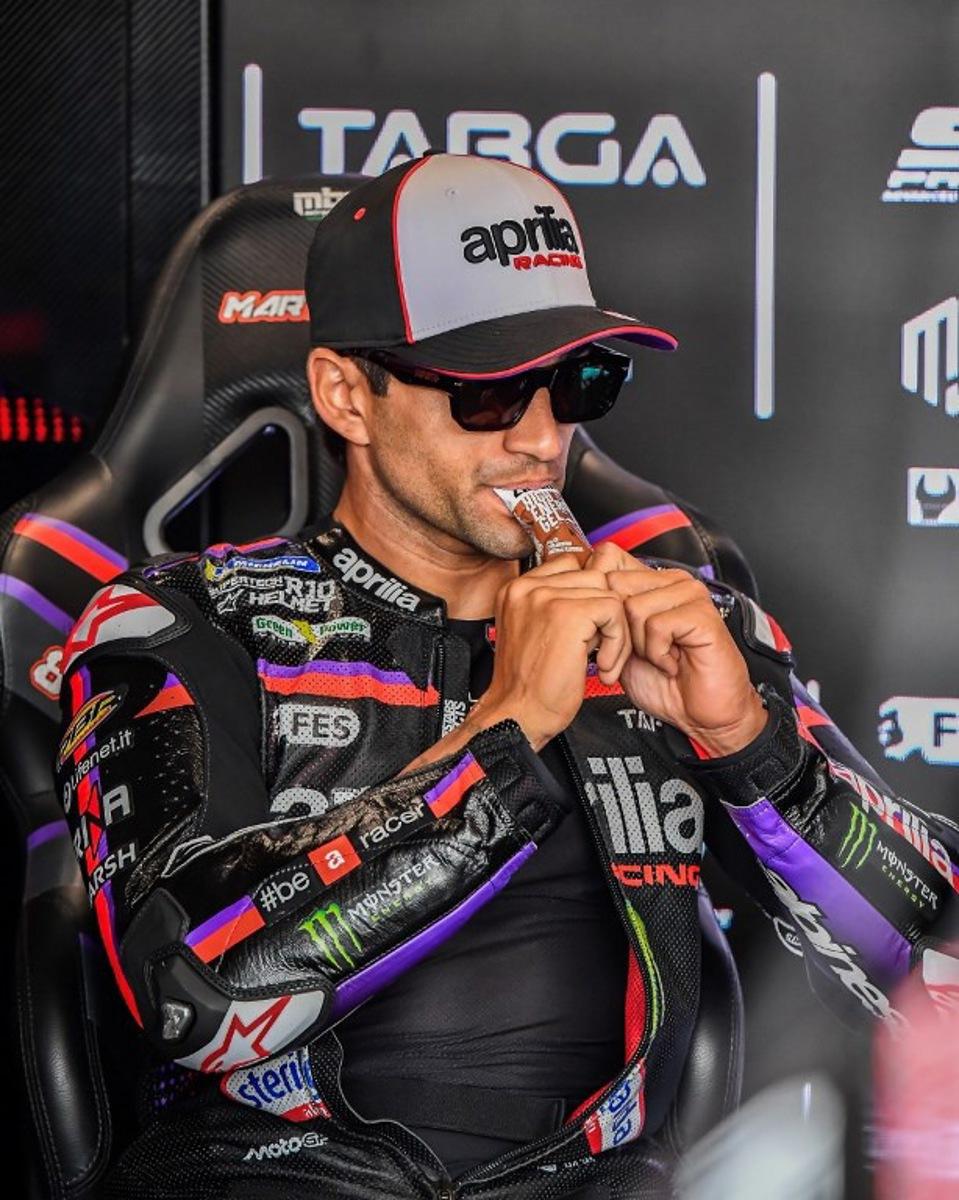 Team Aprilia Racing's Jorge Martin eats prior to the Practice session at the Balaton Park Circuit in Balatonfokajar, Hungary, on June 5, 2026, ahead of the Hungarian Motorcycle MotoGP Grand Prix. FERENC ISZA / AFP