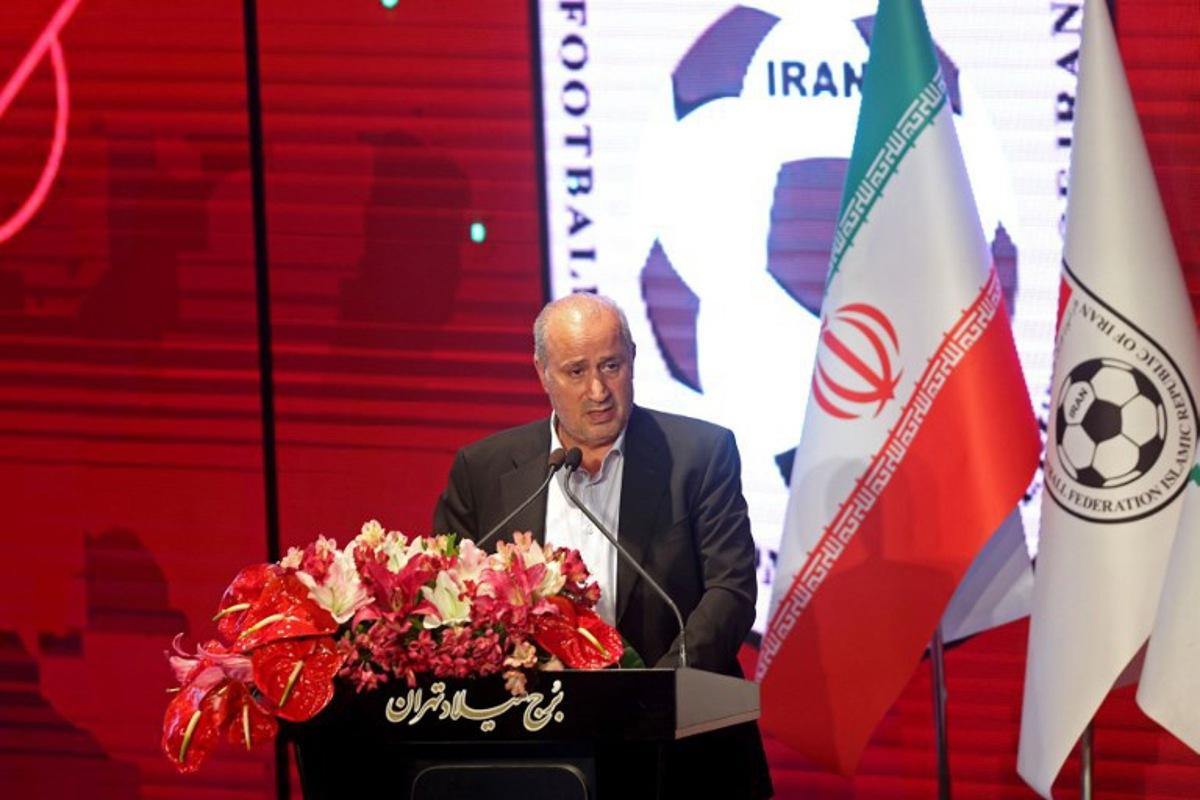 President of the Iranian Football Federation Mehdi Taj speaks during a ceremony in which the new jersey to be used by the Iranian national football team in the upcoming FIFA 2022 Qatar World Cup is unveiled, at Milad Tower in Tehran, on November 8, 2022. ATTA KENARE / AFP