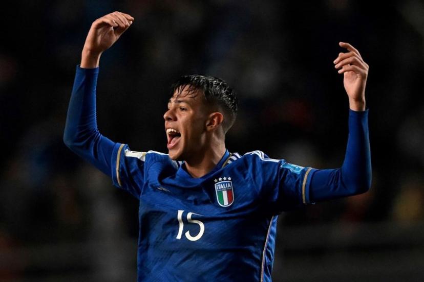 Italy's defender Alessandro Fontanarosa celebrates a goal scored by midfielder Cesare Casadei during the Argentina 2023 U-20 World Cup round of 16 football match between England and Italy at the Diego Armando Maradona stadium in La Plata, Argentina, on May 31, 2023. LUIS ROBAYO / AFP