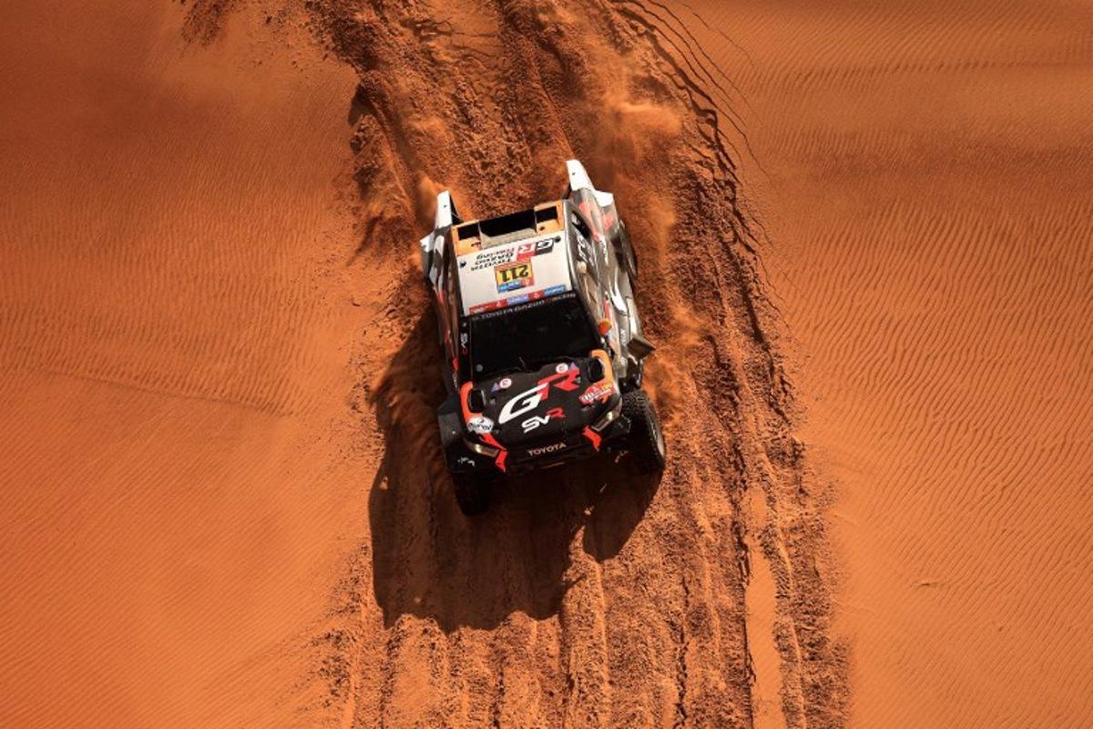 South African driver Henk Lategan and South African co-driver Breet Cummings compete during Stage 8 of the Dakar Rally 2025, between Al Duwadimi and Riyadh, Saudi Arabia, on January 13, 2025. Valery HACHE / AFP