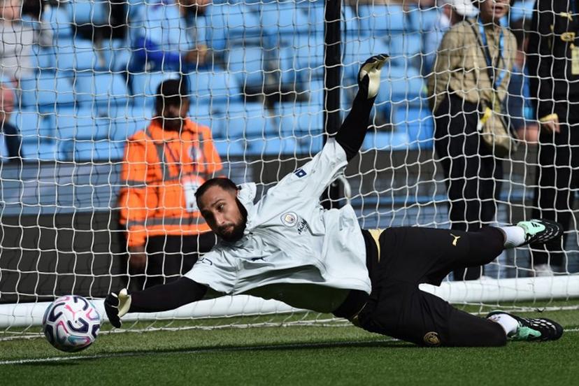 Manchester City's Italian goalkeeper #01 Gianluigi Donnarumma warms up ahead of the English Premier League football match between Manchester City and Sunderland at the Etihad Stadium in Manchester, north west England, on September 20, 2026. PETER POWELL / AFP