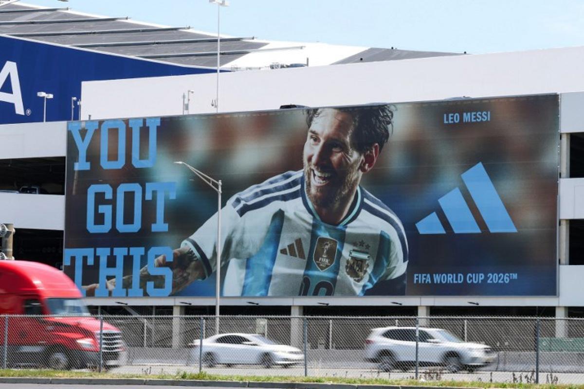 Vehicles pass by a parking garage with a billboard featuring Argentina's Lionel Messi, next to the New York New Jersey Stadium (temporarily renamed from MetLife Stadium) ahead of the 2026 FIFA World Cup in East Rutherford, New Jersey, on June 9, 2026. TIMOTHY A. CLARY / AFP