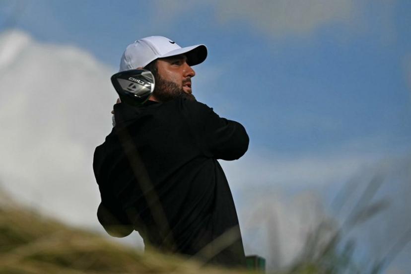 US golfer Scottie Scheffler watches his drive from the 12th tee on day three of the 153rd Open Championship at Royal Portrush golf club in Northern Ireland on July 19, 2025. Glyn KIRK / AFP