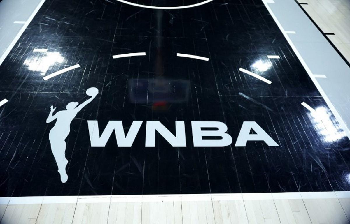 A WNBA logo is shown on the court before a game between the Connecticut Sun and the Las Vegas Aces at Michelob ULTRA Arena on June 25, 2025 in Las Vegas, Nevada. NOTE TO USER: User expressly acknowledges and agrees that, by downloading and or using this photograph, User is consenting to the terms and conditions of the Getty Images License Agreement. WNBA players have given their backing to calling a strike "when necessary" as negotiations over a new collective bargaining agreement continue, union chiefs said on December 18, 2025. The Women's National Basketball Players Association said in a statement its members had voted in favor of authorizing the union's leadership to call a strike if needed. Ethan Miller / GETTY IMAGES NORTH AMERICA / AFP