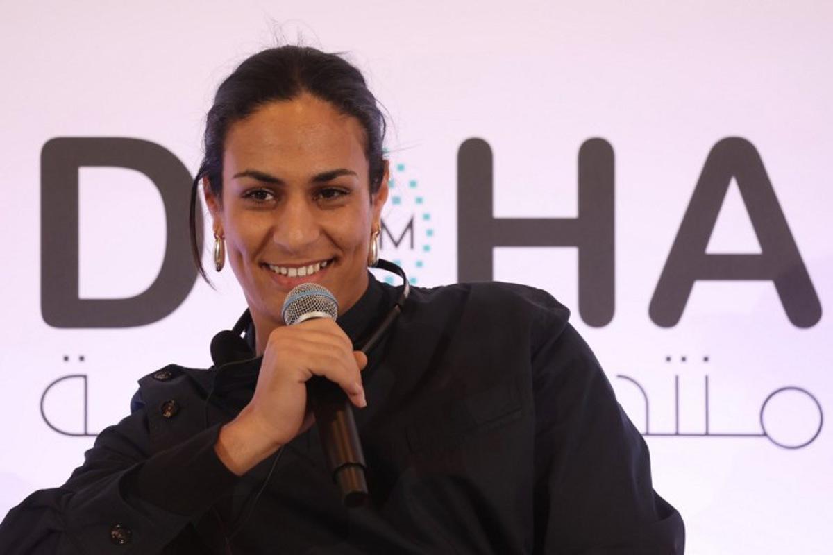 Algerian gold medallist boxer Imane Khelif speaks during the Doha Forum in the Qatari capital on December 7, 2024. KARIM JAAFAR / AFP