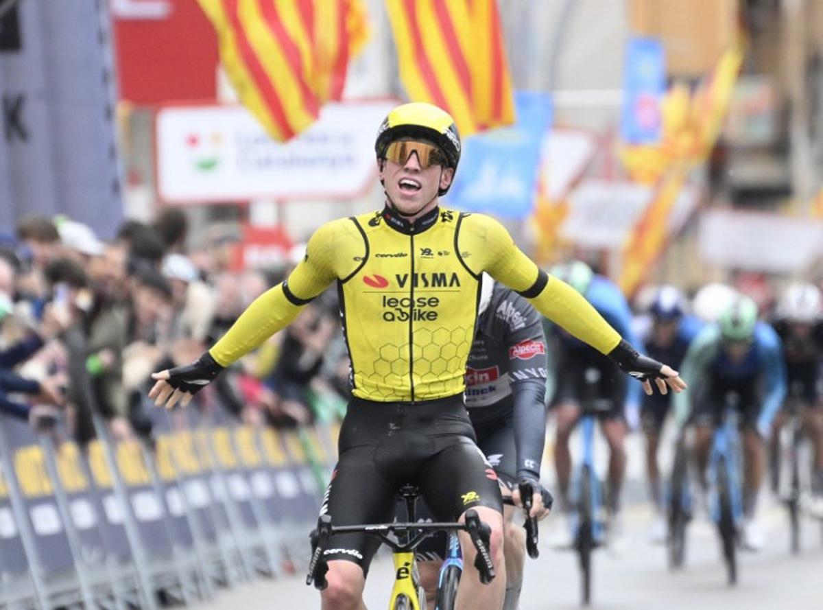 Team Visma's British rider James Matthew Brennan (L) celebrates crossing first the finish line ahead of Team Alpecin's Kaden Groves at the end of the first stage of the 2025 Volta a Catalonya cycling tour of Catalonya, a 178,3 km loop starting and finishing in Sant Feliu de Guixols, on March 24, 2025. Josep LAGO / AFP