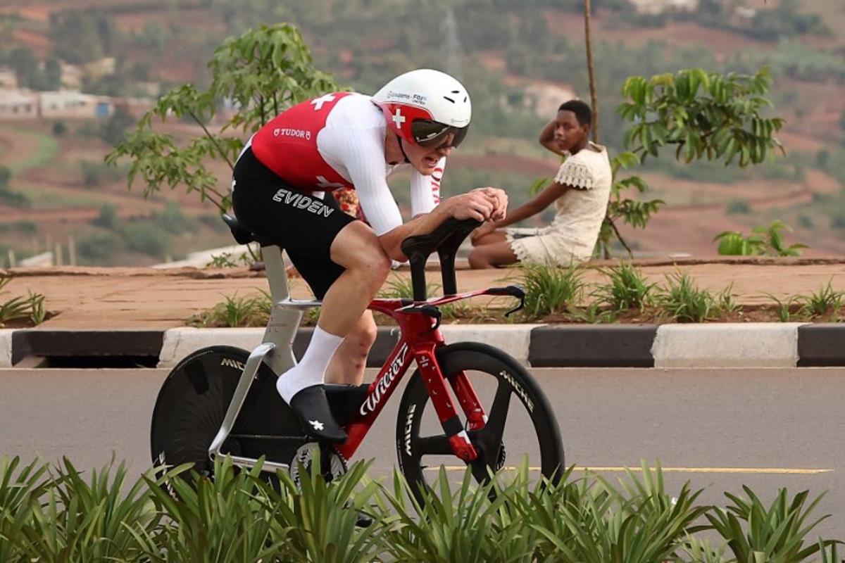 Swiss rider Stefan Kung competes in the men's Elite Individual Time Trial cycling event during the UCI 2025 Road World Championships, in Kigali, on September 21, 2025. Anne-Christine POUJOULAT / AFP