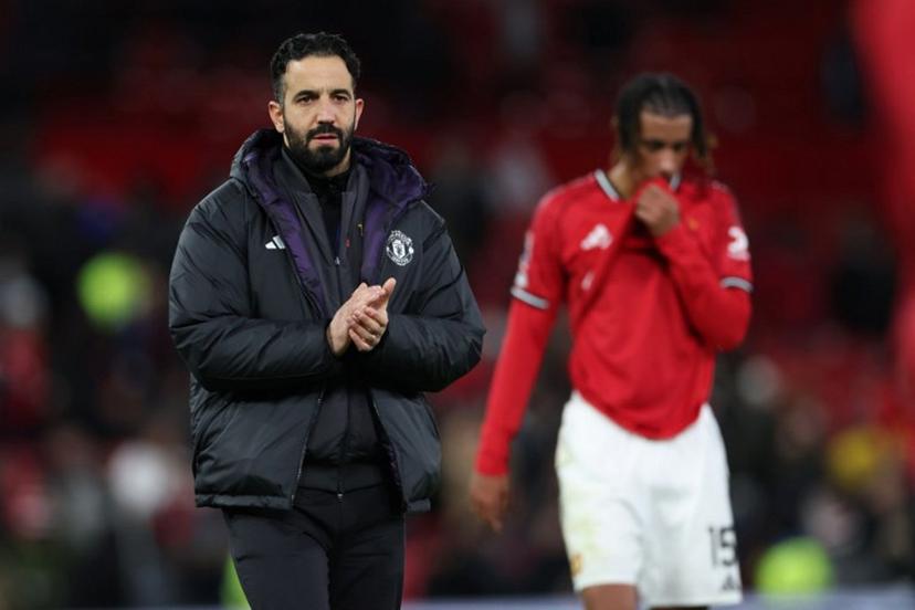 Manchester United's Portuguese head coach Ruben Amorim applauds fans on the pitch after the English Premier League football match between Manchester United and Everton at Old Trafford in Manchester, north west England, on November 24, 2025. Everton won the game 1-0. Darren Staples / AFP
