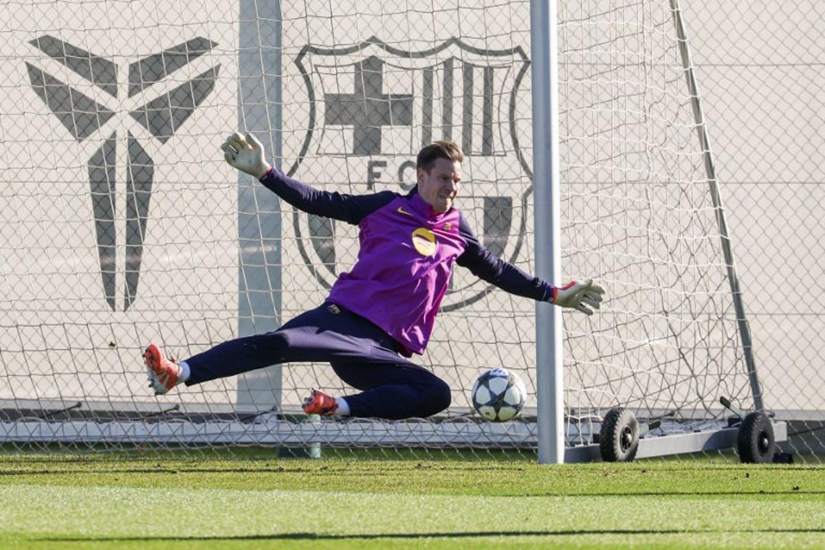 Barcelona's German goalkeeper # Marc-Andre Ter Stegen attends a training session on the eve of the UEFA Champions League league phase day 6 football match between FC Barcelona and Eintracht Frankfurt at the Joan Gamper training ground in Sant Joan Despi, near Barcelona, on December 8, 2025. Lluis GENE / AFP