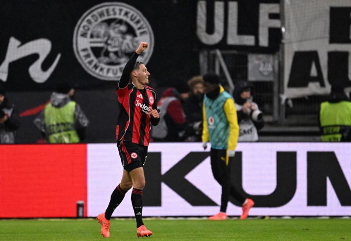 Frankfurt's German forward #11 Younes Ebnoutalib celebrates scoring the 2-2 goal during the German first division Bundesliga football match between Eintracht Frankfurt and BVB Borussia Dortmund in Frankfurt am Main, western Germany, on January 9, 2026. Kirill KUDRYAVTSEV / AFP