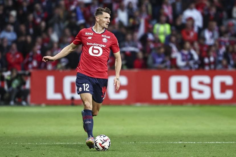Lille's Belgian defender #12 Thomas Meunier runs with the ball during the French L1 football match between Lille (LOSC) and Olympique de Marseille (OM) at the Pierre-Mauroy stadium in Villeneuve-d'Ascq, northern France, on May 4, 2025. Sameer Al-DOUMY / AFP