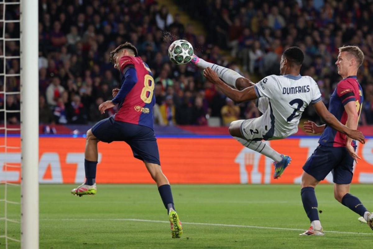 Inter Milan's Dutch defender #02 Denzel Dumfries scores his team's second goal during the UEFA Champions League semi final first leg football match between FC Barcelona and Inter Milan at the Estadi Olimpic Lluis Companys in Barcelona on April 30, 2025. LLUIS GENE / AFP