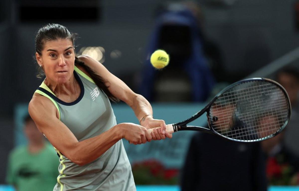 Romania's Sorana Cirstea returns the ball to Poland's Iga Swiatek during their second round of the 2024 WTA Tour Madrid Open tournament tennis match at Caja Magica in Madrid on April 27, 2024. Thomas COEX / AFP