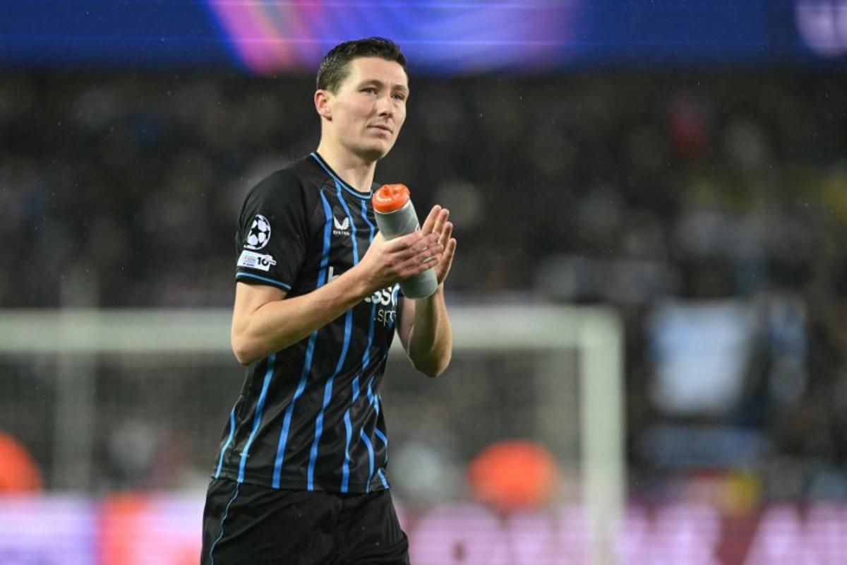 Club Brugge's Belgian midfielder #20 Hans Vanaken reacts at the end of the UEFA Champions League knockout round play-off first leg football match between Club Brugge and Atletico Madrid at the Jan Breydel Stadium in Brugge on February 18, 2026. NICOLAS TUCAT / AFP