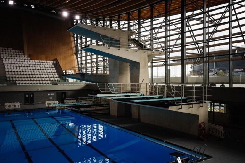 This photograph taken on March 28, 2024 shows diving boards, next to a swimming pool, in the Aquatics Centre built for the Paris 2024 Olympic Games to be used for artistic swimming, diving and water polo competitions in Saint Denis, near Paris. Dimitar DILKOFF / AFP