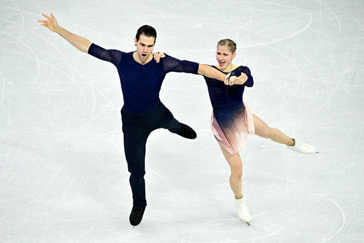 Germany's Minerva Fabienne Hase and Nikita Volodin compete in the figure skating pair skating free skating final during the Milano Cortina 2026 Winter Olympic Games at Milano Ice Skating Arena in Milan on February 16, 2026. JULIEN DE ROSA / AFP