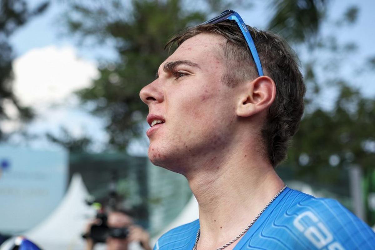 Italian rider Lorenzo Mark Finn reacts after winning the men's U23 road race cycling event during the UCI 2025 Road World Championships, in Kigali, on September 26, 2025. Anne-Christine POUJOULAT / AFP