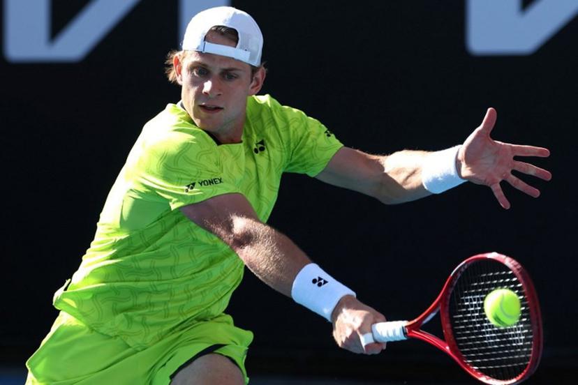 Belgium's Zizou Bergs hits a return to Poland's Hubert Hurkacz during their men's singles match on day three of the Australian Open tennis tournament in Melbourne on January 20, 2026. IZHAR KHAN / AFP