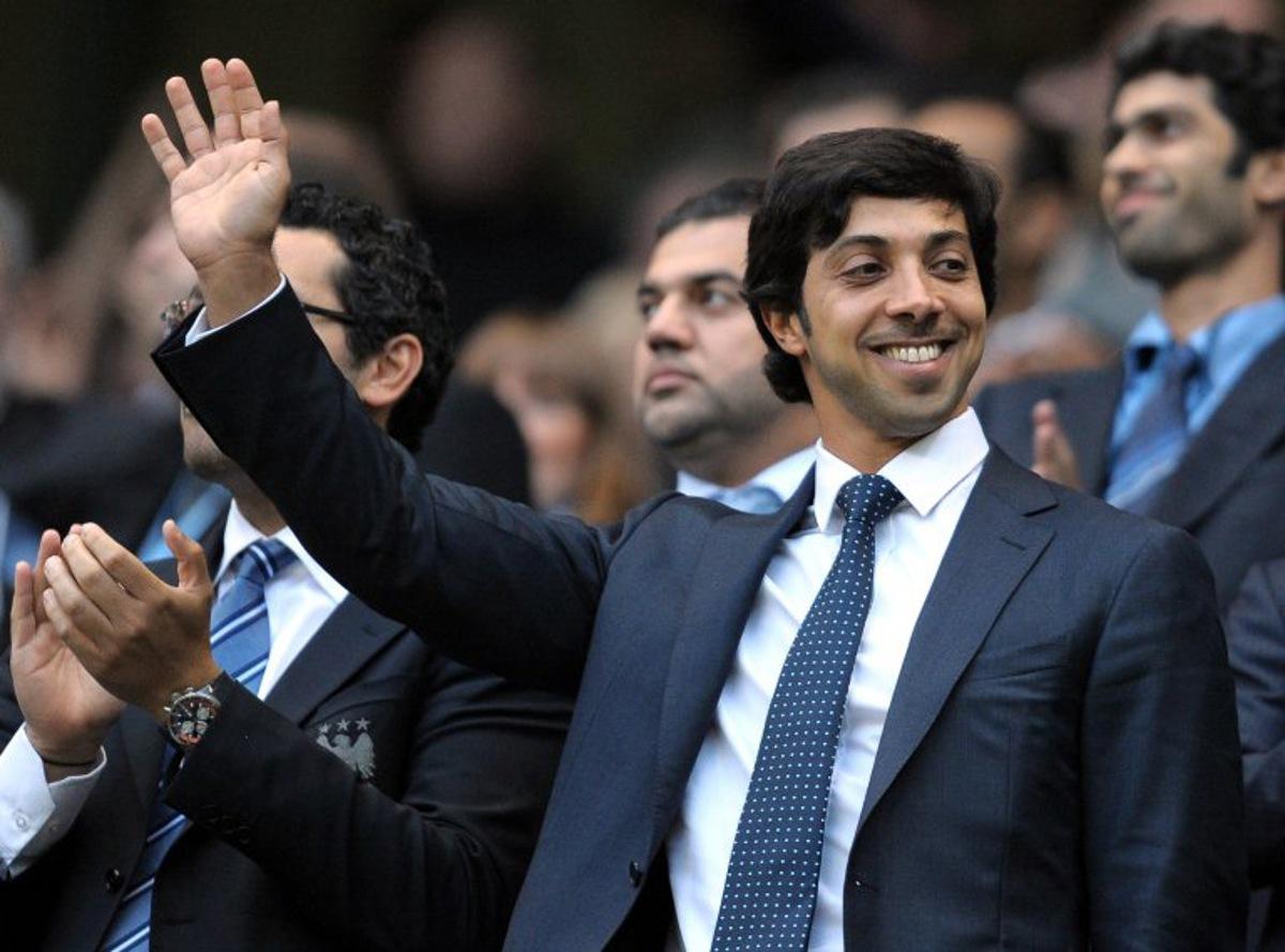 (FILES) Manchester city owner Sheikh Mansour bin Zayed Al Nahyan (C) looks on during the English Premier League football match against Liverpool at The City of Manchester stadium, Manchester, north-west England on August 23, 2010. Manchester City have been found guilty of all but one of 115 Premier League charges they face for breaching financial regulations, the Athletic reported on Friday, September 25, 2026. Andrew YATES / AFP