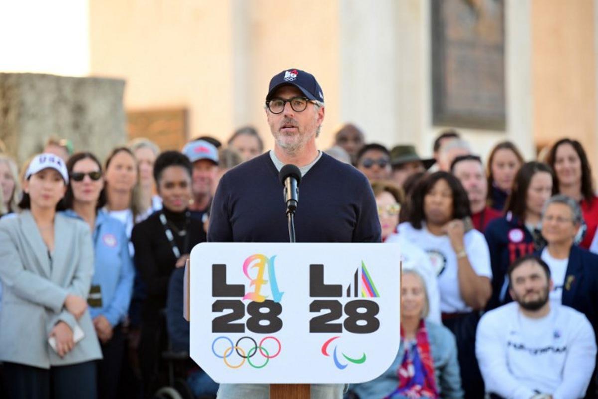 Chairman of the LA2028 Olympics Organizing Committee Casey Wasserman speaks during a ceremonial lighting of the LA28 Olympic cauldron at the Memorial Coliseum in Los Angeles on January 13, 2026, ahead of the launch of ticket registration for the 2028 Summer Olympic Games. Frederic J. Brown / AFP