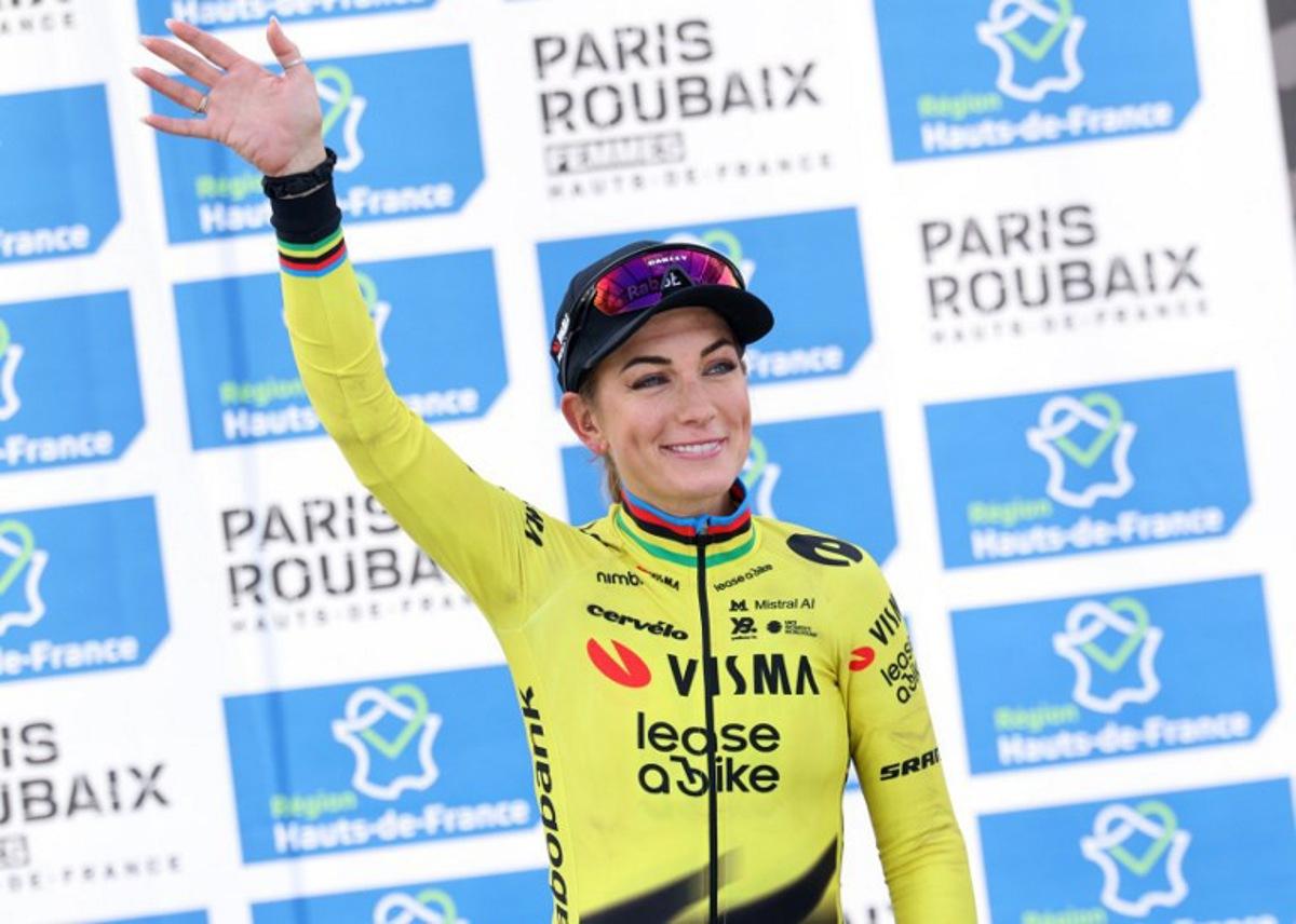 Third-placed Team Visma - Lease a Bike's French rider Pauline Ferrand-Prévot celebrates on the podium of the 6th edition of the Women Paris-Roubaix one-day classic cycling race, 143.1 km between Denain and Roubaix, at the Vélodrome André-Pétrieux in Roubaix, northern France, on April 12, 2026. Francois LO PRESTI / AFP