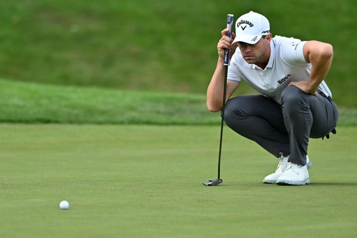 Belgium's Thomas Detry lines up a putt on the 18th green on day two of the BMW PGA Championship at Wentworth Golf Club, south-west of London, on September 15, 2023. Glyn KIRK / AFP