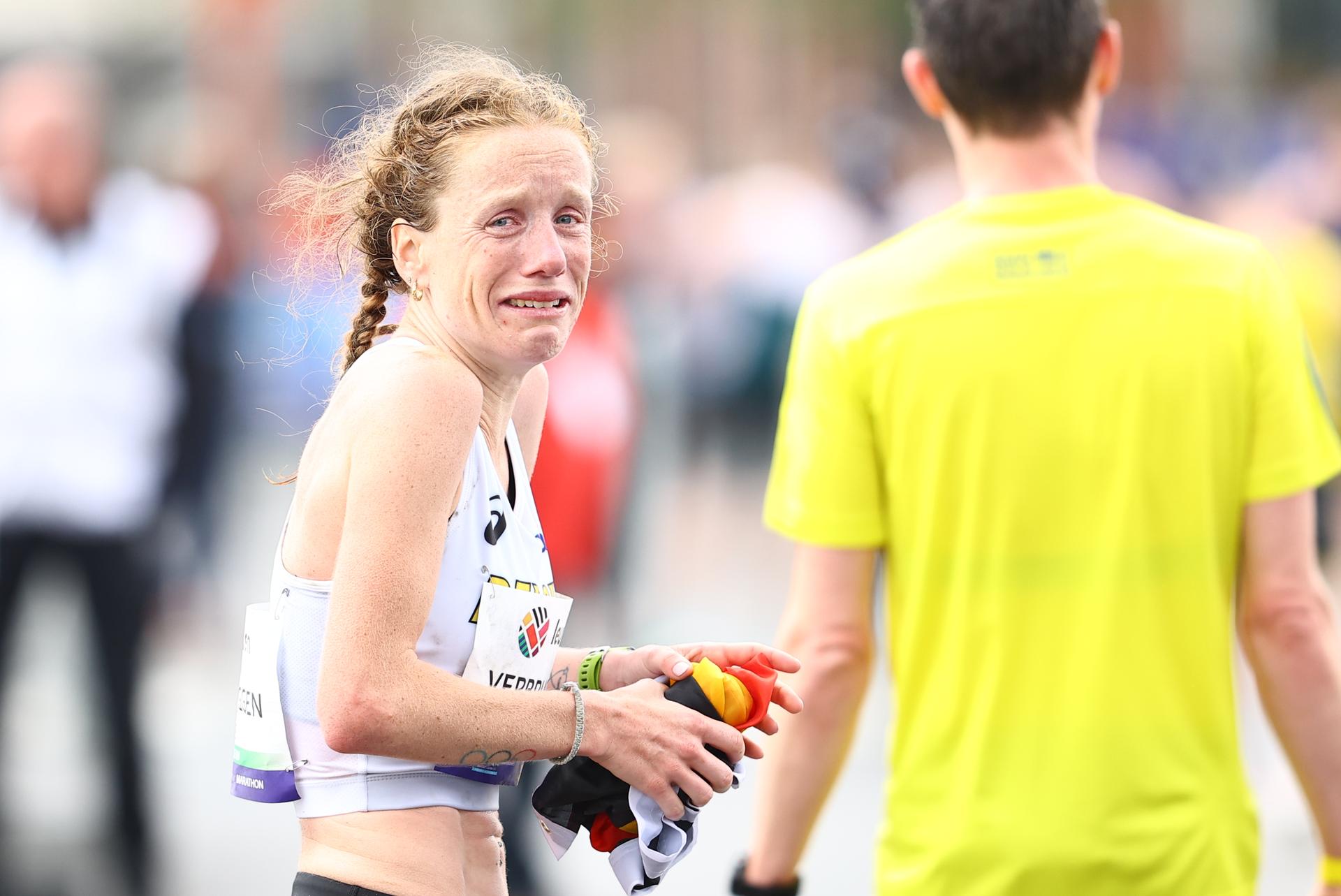 Belgian Hanne Verbruggen reacts after finishing 12th at the women marathon race at European Running Championships, from Leuven to Brussels, Sunday 13 April 2025. BELGA PHOTO DAVID PINTENS