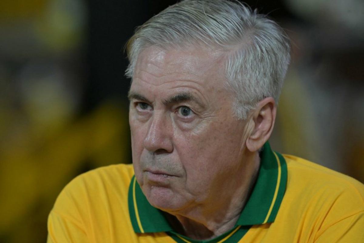 Brazil's Italian head coach Carlo Ancelotti gestures while attending the second night of carnival parade in the Sambadrome in Sao Paulo, Brazil, on February 14, 2026. NELSON ALMEIDA / AFP