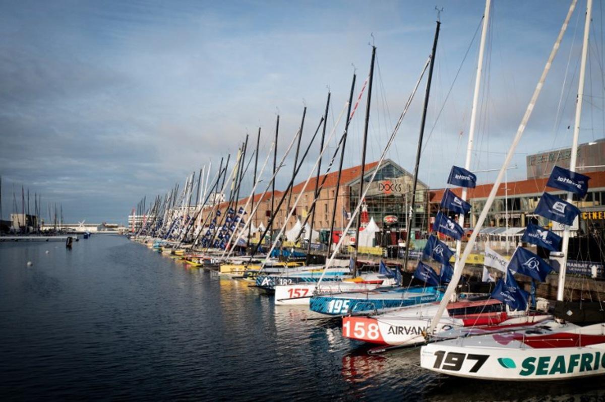 This aerial photograph shows sailboats moored in the docks before the start of the Transat Cafe l'OR (former Transat Jacques Vabre) duo sailing race from Le Havre to Fort-de-France, in Le Havre, north-western France, on October 22, 2025. The MOCA, Ocean Fifty, ULTIM, and Class40 boats will take the start of the race on October 26, 2025. Lou BENOIST / AFP